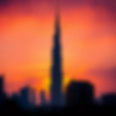 Silhouetted Burj Khalifa against a vibrant sunrise